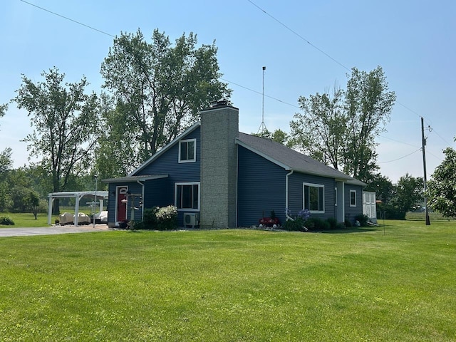 6586 N Coleman Rd, Coleman, MI 48618 - view of side of home featuring a chimney, a lawn, and ac unit