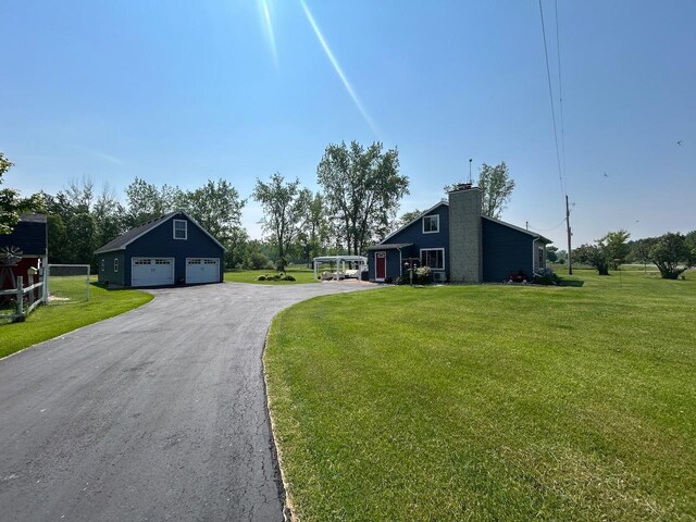 6586 N Coleman Rd, Coleman, MI 48618 - view of asphalt driveway