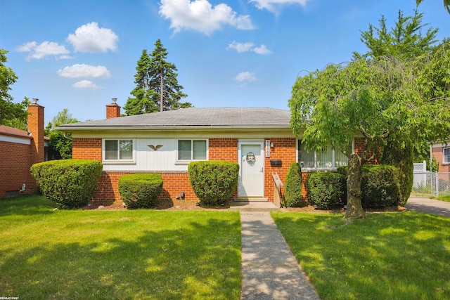 31565 Hayes Rd, Warren, MI 48088 - view of front of property featuring brick siding, a chimney, and entry steps