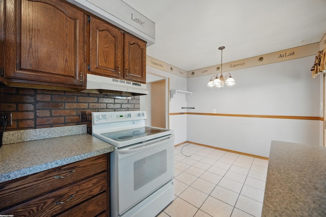 31565 Hayes Rd, Warren, MI 48088 - kitchen featuring white electric range oven, under cabinet range hood, backsplash, light tile patterned floors, and a chandelier
