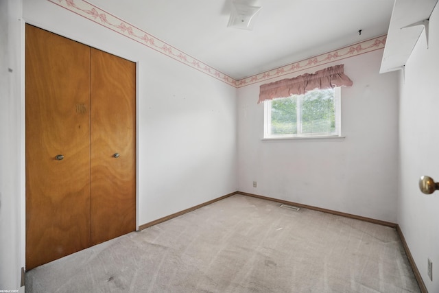 31565 Hayes Rd, Warren, MI 48088 - unfurnished bedroom featuring light colored carpet, baseboards, and a closet