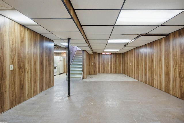 31565 Hayes Rd, Warren, MI 48088 - finished below grade area with wooden walls, freestanding refrigerator, stairway, and a drop ceiling