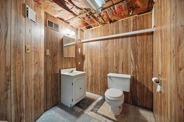 31565 Hayes Rd, Warren, MI 48088 - half bathroom with vanity, toilet, and wooden walls