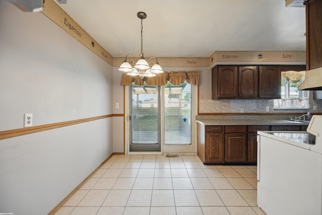 31565 Hayes Rd, Warren, MI 48088 - kitchen with a chandelier, dark brown cabinetry, and backsplash