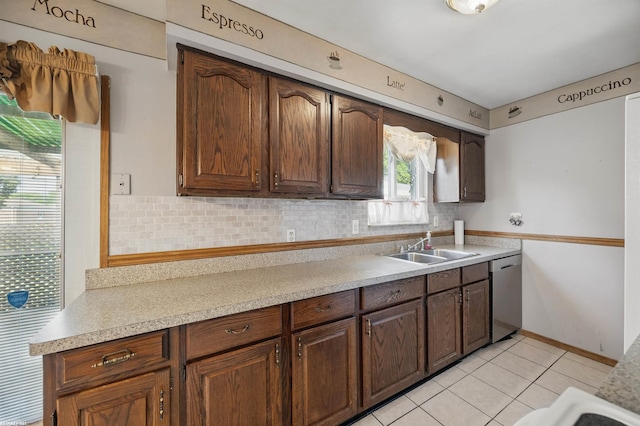 31565 Hayes Rd, Warren, MI 48088 - kitchen with dishwasher, a sink, tasteful backsplash, light countertops, and light tile patterned floors