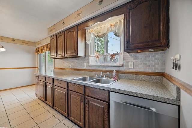 31565 Hayes Rd, Warren, MI 48088 - kitchen with dishwasher, a sink, tasteful backsplash, light tile patterned floors, and light countertops