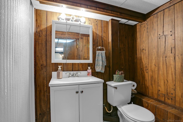 28052 Loretta Ave, Warren, MI 48092 - bathroom with vanity, toilet, and wooden walls