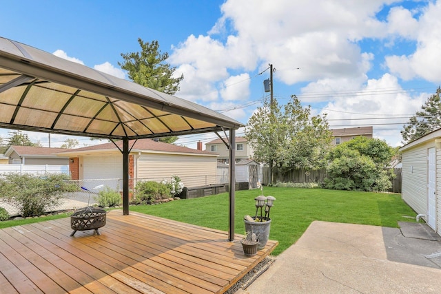 28052 Loretta Ave, Warren, MI 48092 - deck featuring an outdoor fire pit, a gazebo, and a garage