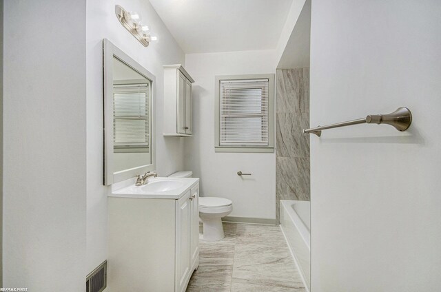17844 Stephens St, Eastpointe, MI 48021 - bathroom with vanity, toilet, and marble look tile flooring