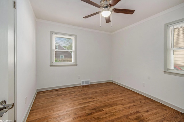 17844 Stephens St, Eastpointe, MI 48021 - spare room with healthy amount of natural light, ornamental molding, wood finished floors, baseboards, and a ceiling fan