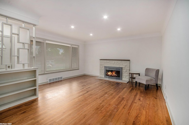 17844 Stephens St, Eastpointe, MI 48021 - unfurnished living room with light wood-style flooring, baseboards, a stone fireplace, and recessed lighting
