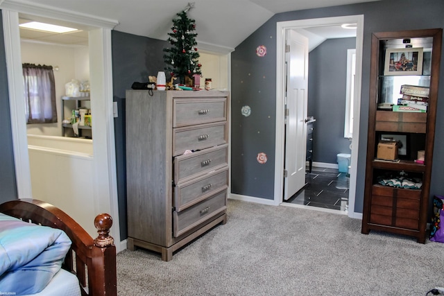 1002 Garfield St, Port Huron, MI 48060 - bedroom with carpet, vaulted ceiling, connected bathroom, and baseboards