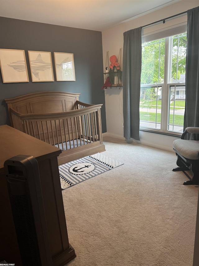 1591 Larkmoor Blvd, Berkley, MI 48007 - carpeted bedroom featuring multiple windows, baseboards, and a nursery area