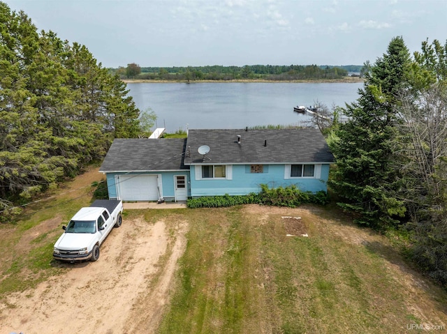 8096 Garth Point 25.25 Ln Rd, Rapid River, MI 49878 - view of front of home featuring driveway, a water view, and a garage