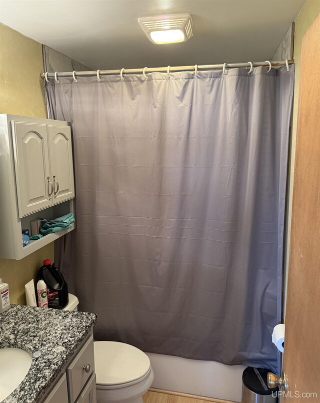 8096 Garth Point 25.25 Ln Rd, Rapid River, MI 49878 - bathroom with vanity, toilet, and shower / tub combo