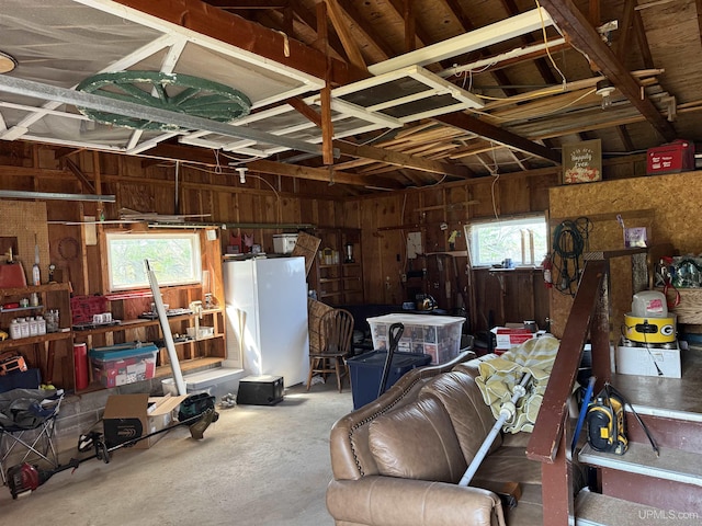 8096 Garth Point 25.25 Ln Rd, Rapid River, MI 49878 - garage with freestanding refrigerator and wood walls