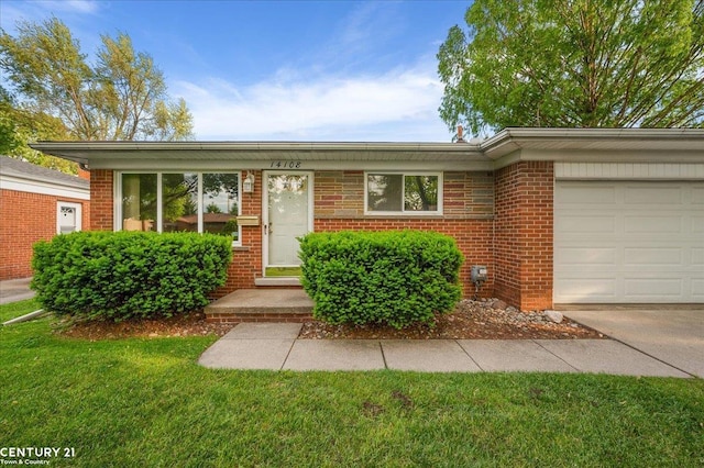14108 La Chene Ave, Warren, MI 48088 - ranch-style home with brick siding, an attached garage, and a front lawn