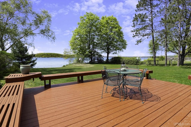 1426 Washington St, Munising, MI 49862 - deck with a water view, a lawn, and outdoor dining area