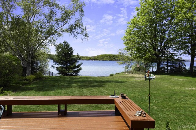 1426 Washington St, Munising, MI 49862 - wooden terrace featuring a water view and a lawn