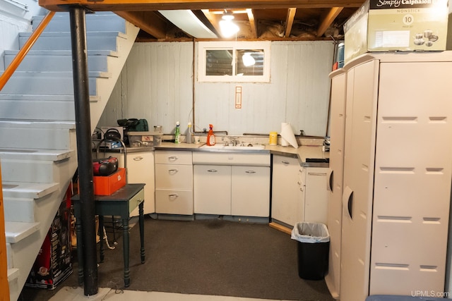 1426 Washington St, Munising, MI 49862 - below grade area with a sink and dark colored carpet