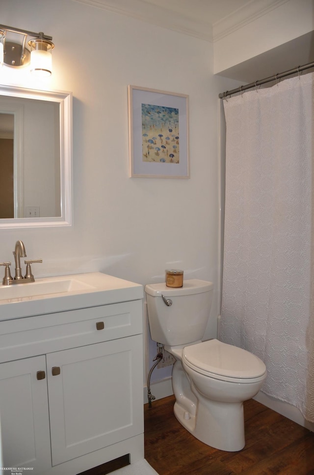 4896 Royal Cove Dr, Shelby Twp, MI 48316 - full bathroom with toilet, wood finished floors, vanity, ornamental molding, and baseboards