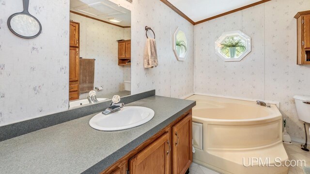 11745 T Rd, Rapid River, MI 49878 - full bathroom with toilet, ornamental molding, a garden tub, vanity, and wallpapered walls