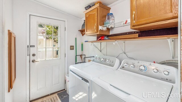 11745 T Rd, Rapid River, MI 49878 - washroom featuring cabinet space, washer and dryer, and crown molding
