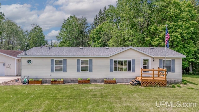 11745 T Rd, Rapid River, MI 49878 - view of front of property with a deck, a front yard, and roof with shingles