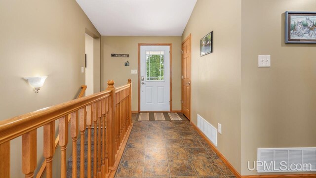 W5716 Warner Ln, Norway, MI 49870 - entryway featuring baseboards and dark stone finish floors