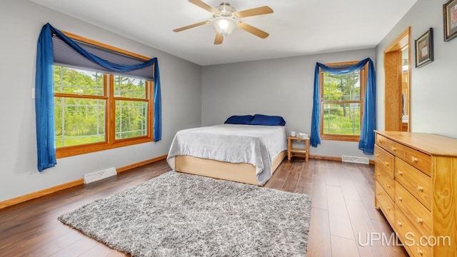 W5716 Warner Ln, Norway, MI 49870 - bedroom featuring wood finished floors, baseboards, and a ceiling fan