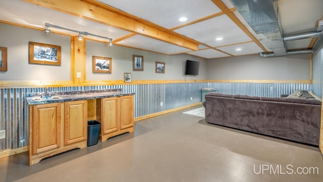 W5716 Warner Ln, Norway, MI 49870 - bar area featuring finished concrete floors, wainscoting, a sink, and recessed lighting