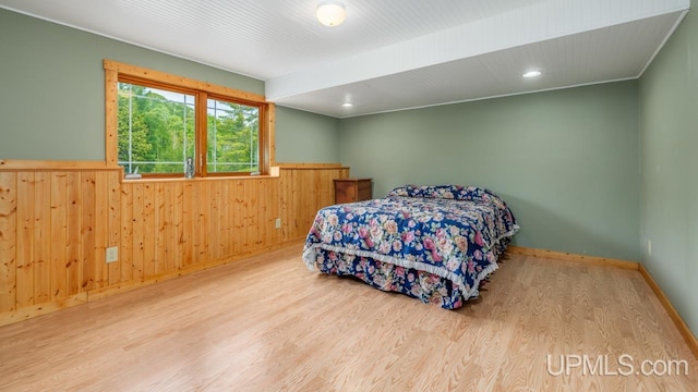 W5716 Warner Ln, Norway, MI 49870 - bedroom featuring a wainscoted wall, wood finished floors, wooden walls, and recessed lighting