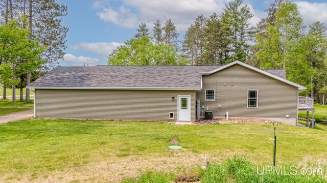 W5716 Warner Ln, Norway, MI 49870 - back of property with a yard and central AC
