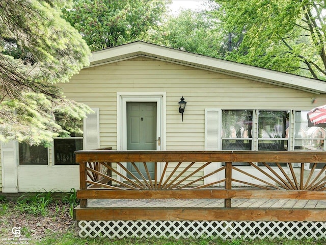 7150 Denissen St, Lexington, MI 48450 - view of front facade featuring a deck