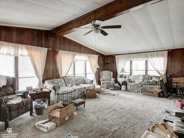 7150 Denissen St, Lexington, MI 48450 - living area with a ceiling fan, wood walls, and carpet floors