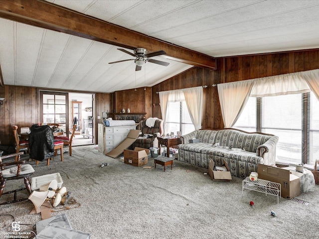 7150 Denissen St, Lexington, MI 48450 - living room with wood walls, ceiling fan, and carpet flooring