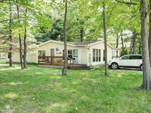 7150 Denissen St, Lexington, MI 48450 - manufactured / mobile home featuring a wooden deck and a front yard