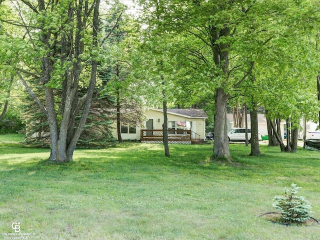 7150 Denissen St, Lexington, MI 48450 - view of green lawn featuring a deck