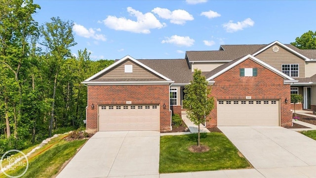 3091 Bridgewater Rd Unit # 28, Auburn Hills, MI 48326 - traditional-style home with brick siding, driveway, a front lawn, and a garage