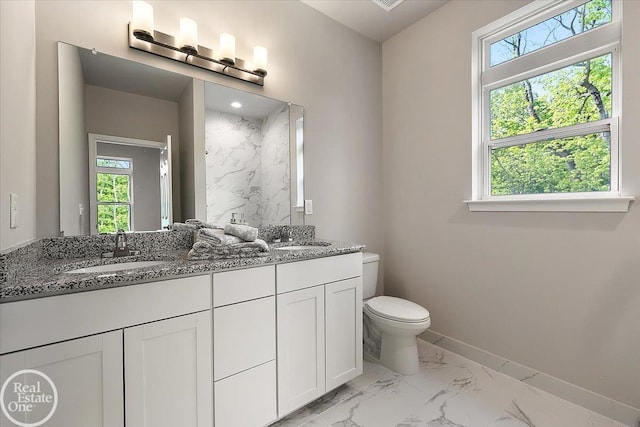 3091 Bridgewater Rd Unit # 28, Auburn Hills, MI 48326 - bathroom with marble finish flooring, toilet, double vanity, and plenty of natural light