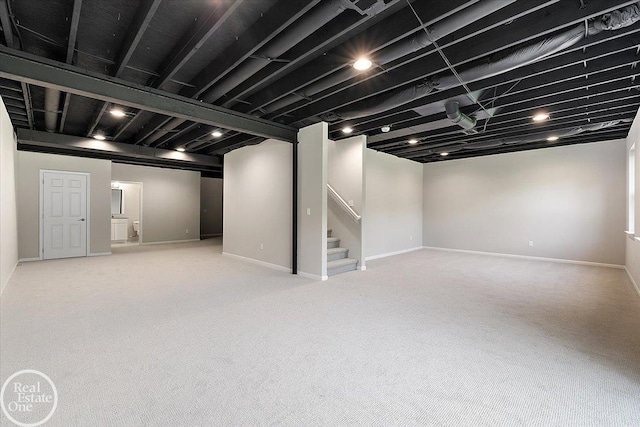 3091 Bridgewater Rd Unit # 28, Auburn Hills, MI 48326 - finished below grade area with stairway, carpet flooring, and baseboards