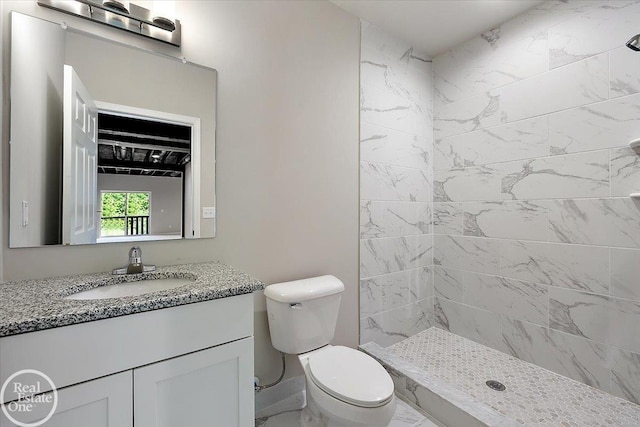 3091 Bridgewater Rd Unit # 28, Auburn Hills, MI 48326 - bathroom featuring vanity, toilet, marble look tile flooring, and a tile shower