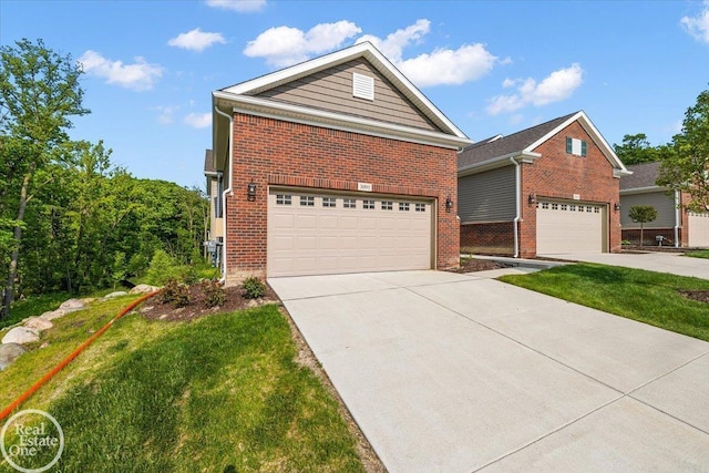 3091 Bridgewater Rd Unit # 28, Auburn Hills, MI 48326 - view of front of home featuring a garage, brick siding, driveway, and a front lawn