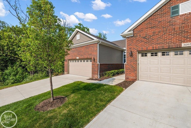 3091 Bridgewater Rd Unit # 28, Auburn Hills, MI 48326 - view of front of house featuring concrete driveway, a garage, brick siding, and a front lawn