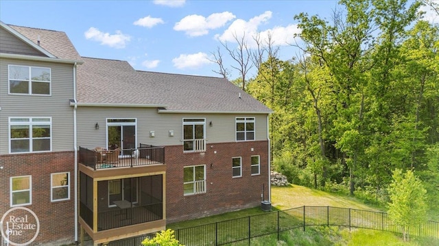 3091 Bridgewater Rd Unit # 28, Auburn Hills, MI 48326 - back of property with a sunroom, a balcony, brick siding, and a shingled roof