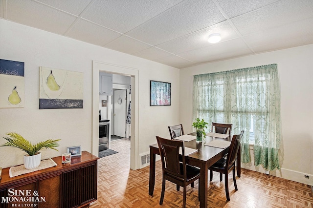 1317 Oak St, Port Huron, MI 48060 - dining space with a paneled ceiling and baseboards