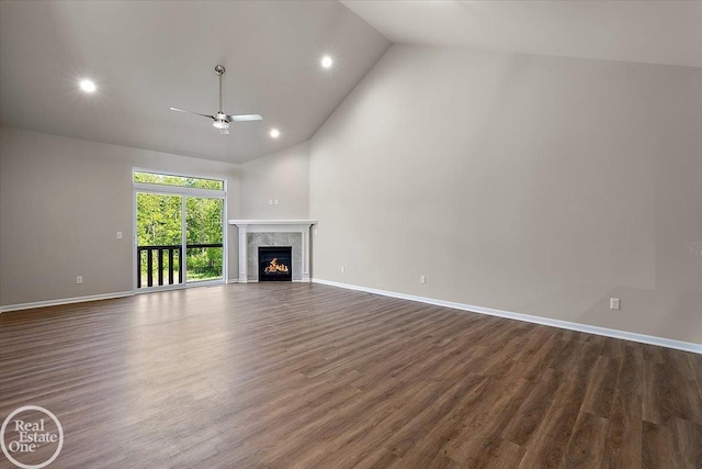 3095 Bridgewater Rd Unit # 30, Auburn Hills, MI 48326 - unfurnished living room with a ceiling fan, high vaulted ceiling, dark wood finished floors, baseboards, and a high end fireplace