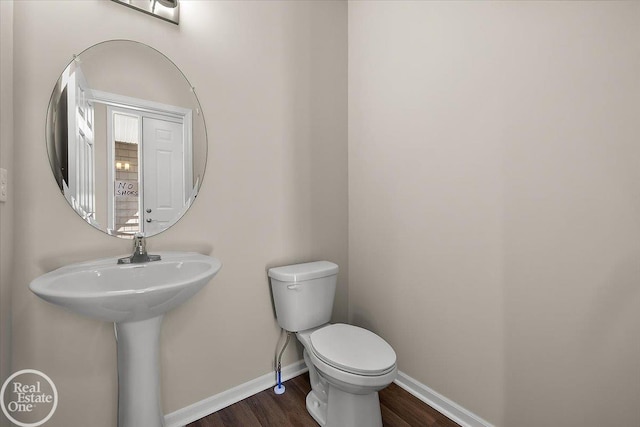 3095 Bridgewater Rd Unit # 30, Auburn Hills, MI 48326 - half bathroom featuring wood finished floors, baseboards, and toilet