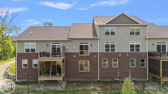 3095 Bridgewater Rd Unit # 30, Auburn Hills, MI 48326 - rear view of property with a balcony, central AC unit, and brick siding