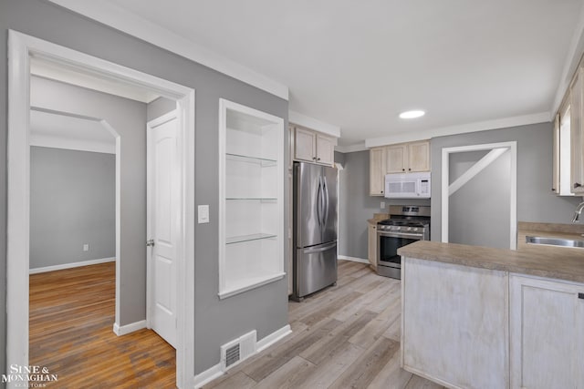 23016 California St, Saint Clair Shores, MI 48080 - kitchen featuring stainless steel appliances, light brown cabinets, light wood finished floors, baseboards, and recessed lighting